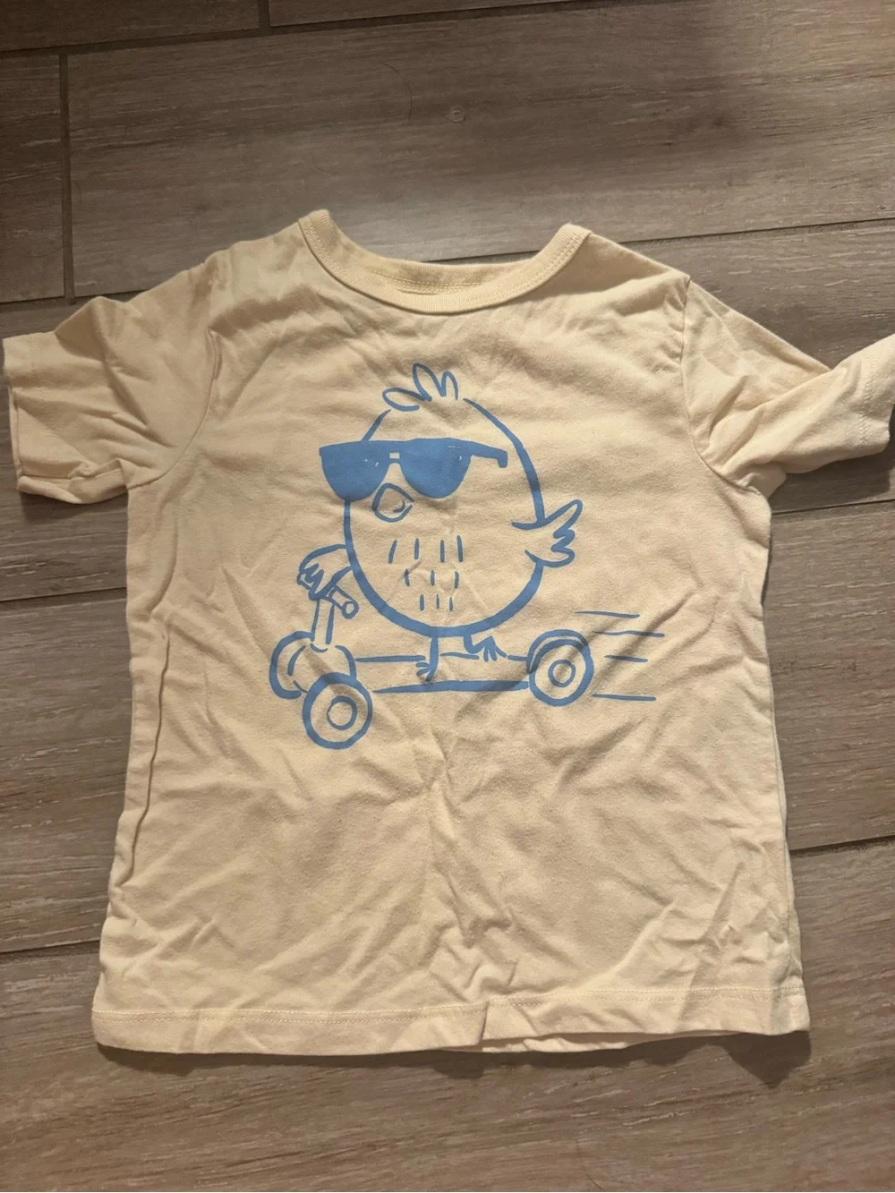 The Children's Place Cream T-Shirt with Blue Scooter Chick Graphic